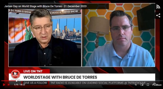 May be an image of 2 people, television, newsroom and text that says 'James Day on World Stage with Bruce De Torres 31 December 2023 TORR ES SHOW ERUCE CET TORFES SHOW RADIO 1 LIVE ON TNT WORLDSTAGE WITH BRUCE DE TORRES W TNT RADIO IS AVAIL ABLE LEADING SOCIAL PLATFORMS TNTRADIC PodBean'