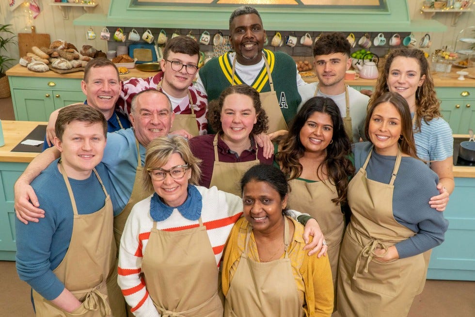 Great British Bake Off 2023 contestants gathered together looking into camera