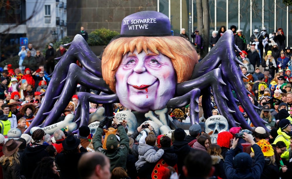 A carnival float shows Christian Democratic Union (CDU) leader and German Chancellor Angela Merkel as black widow at the traditional 