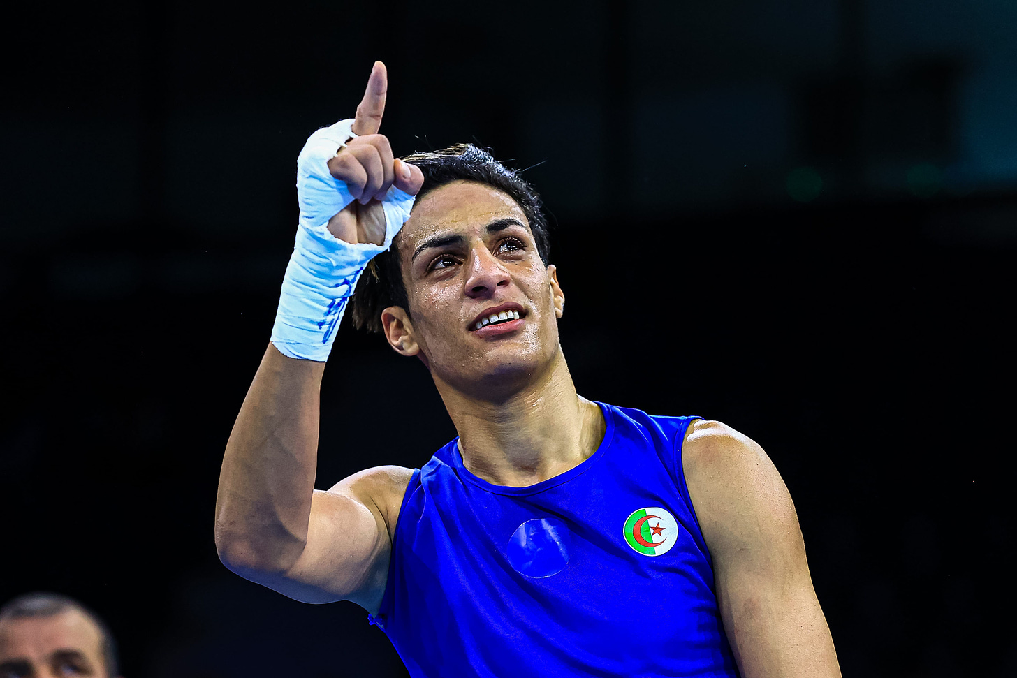 Imane Khelif with her first finger raised indicating that she's number one