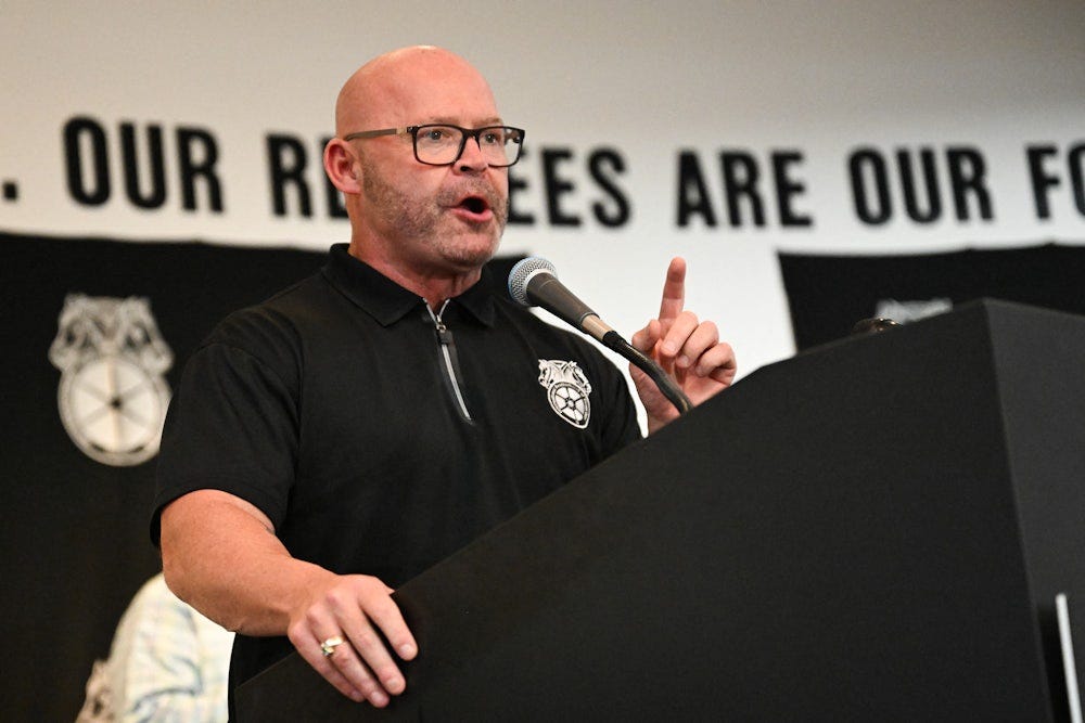 Teamsters General President Sean M. O'Brien speaks during a rally with workers and union members as part of an "Amazon Teamsters Day of Solidarity" in Long Beach, California. 