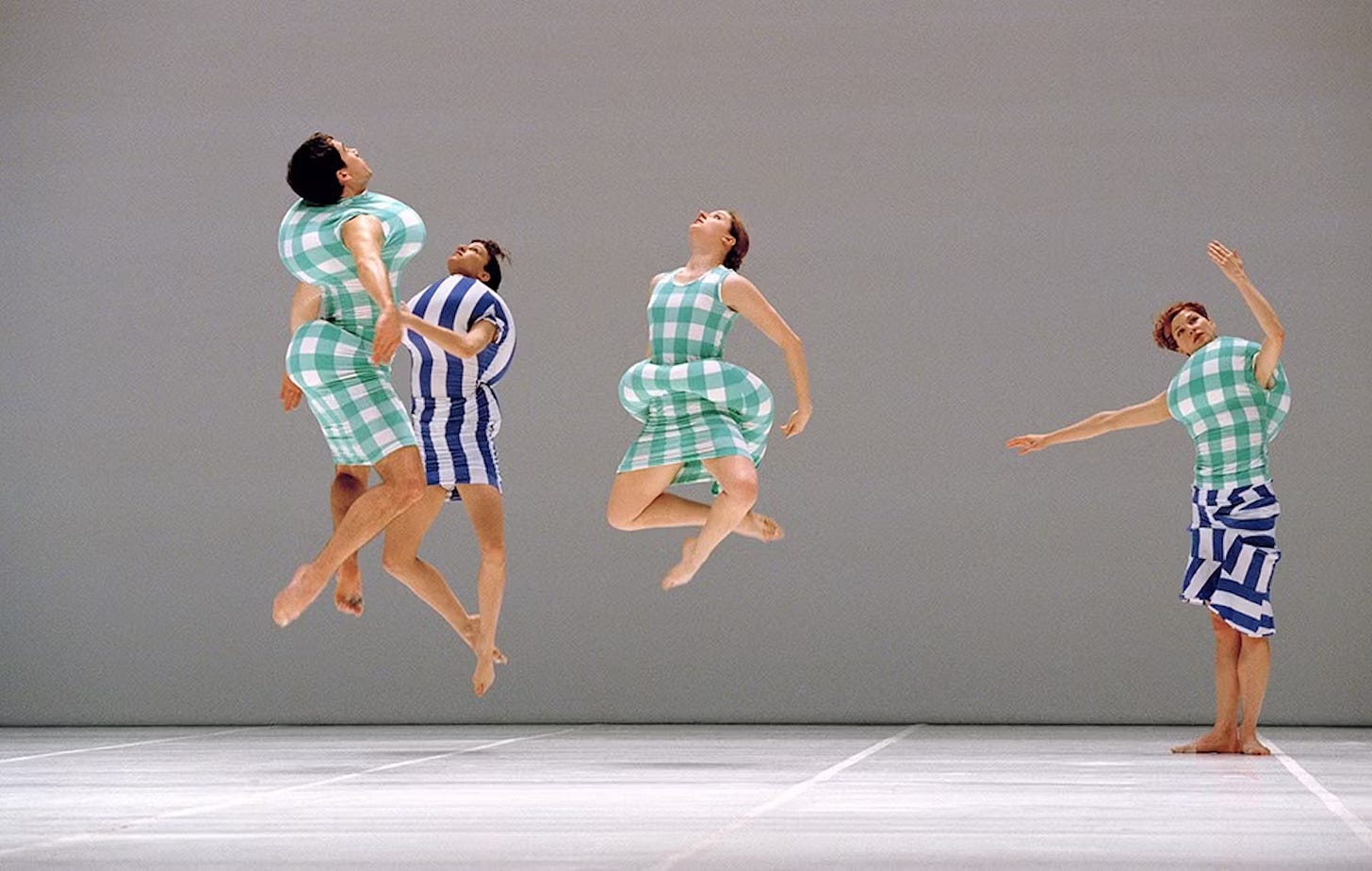 Dancers wearing striped costumes.