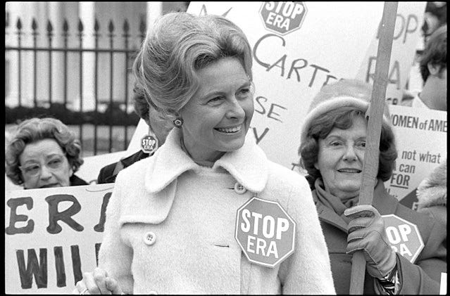 Activist Phyllis Schlafly wearing a "Stop ERA" badge, demonstrating with other women against the Equal Rights Amendment in front of the White House, Washington, D.C., February 4, 1977. (Photo: Library of Congress)