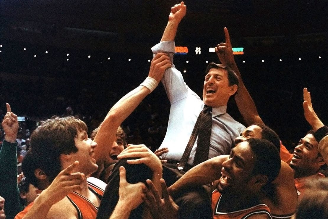 St. John's coach Lou Carnesecca is carried by his team after they beat Boston College in the Big East Championship at Madison Square Garden, in New York, on March 12, 1983.