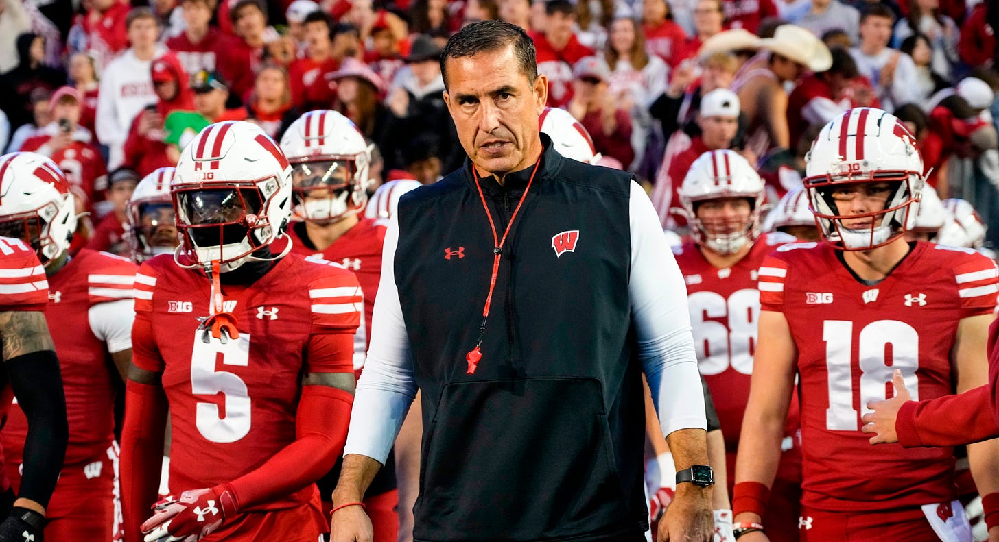 Wisconsin Badgers head coach Luke Fickell walks onto the field during warmups prior to the game at Camp Randall Stadium