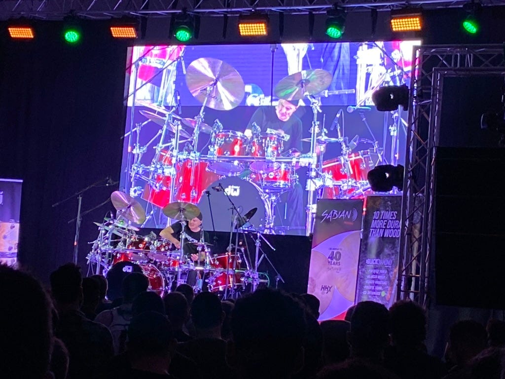 A man playing drums on stage