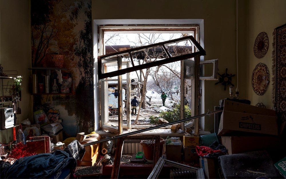 Photo shows residents inspecting their apartments, trying to save surviving belongings and helping each other clear debris after a night drone attack by Russia, in Mykolaiv, Ukraine.