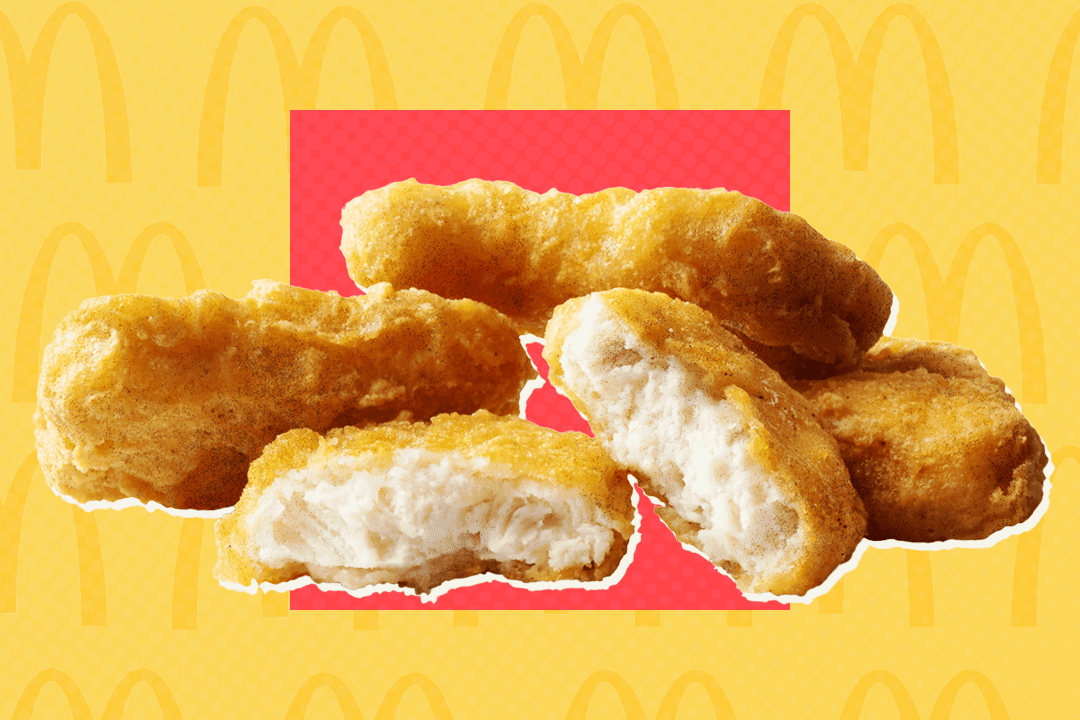 Four pieces of chicken nugget with a McDonald’s logo in the background.