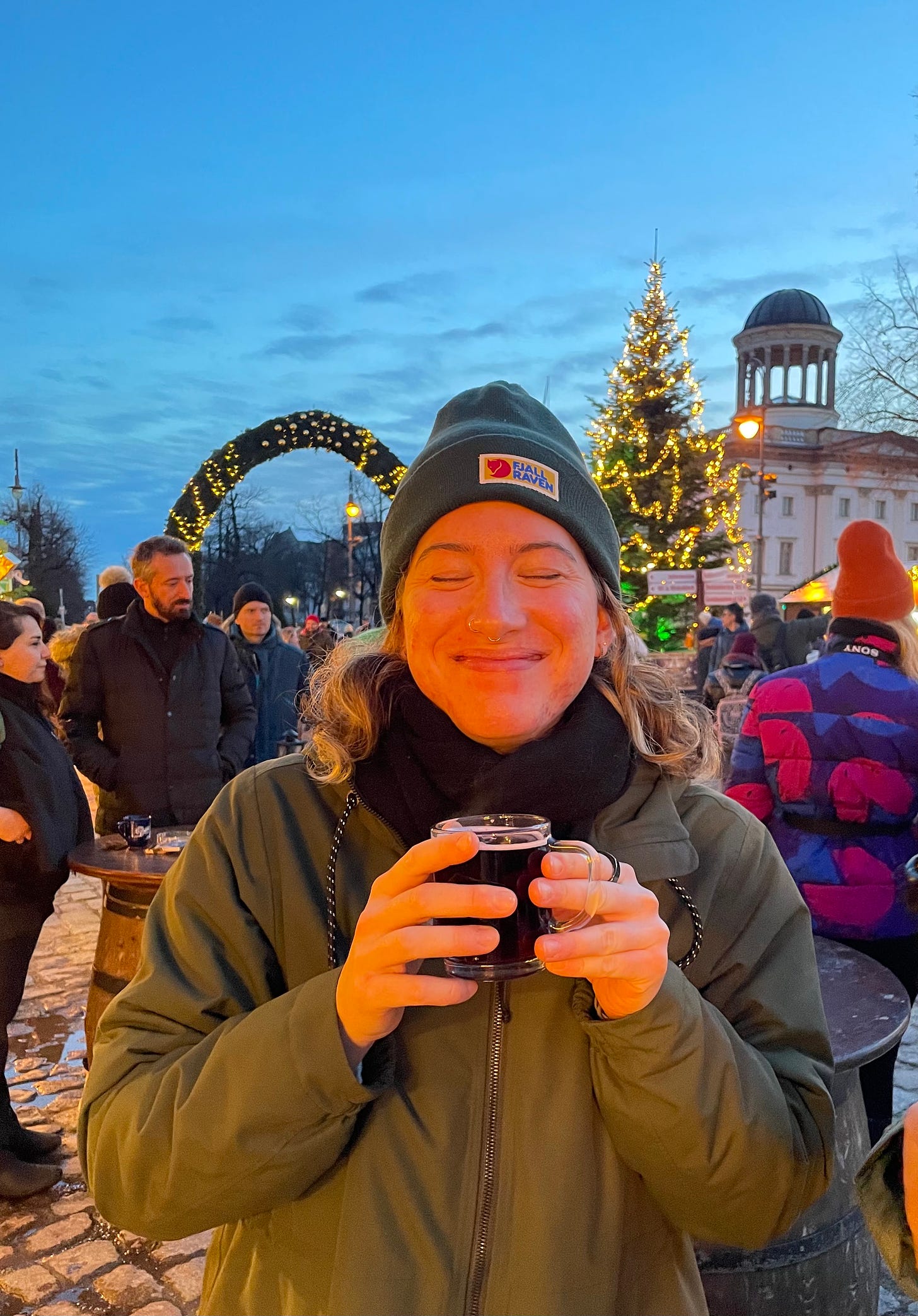 A photo of Maeve cheesing at a German Christmas market
