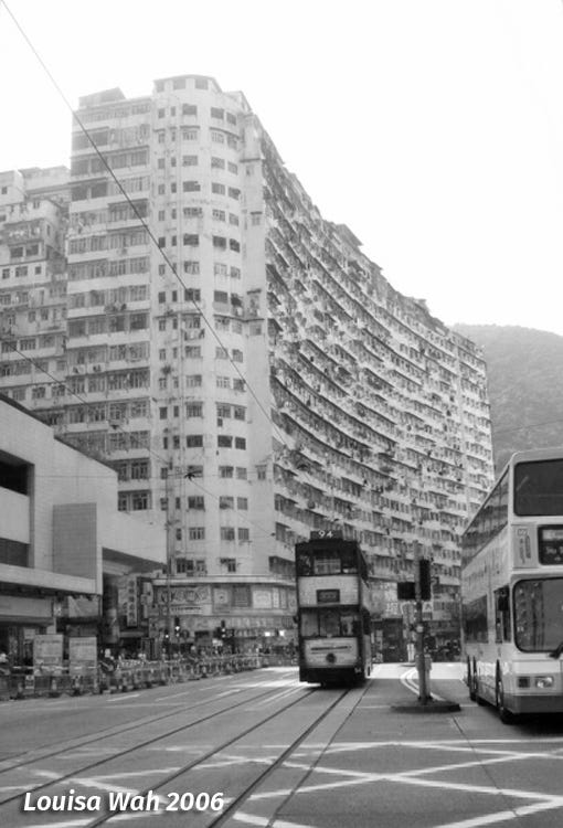 A tram passing by Monster Building, Hong Kong. Photo by Louisa Wah.