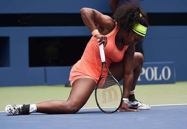 Serena Williams of the US reacts while playing against Roberta Vinci of Italy during their 2015 US Open Women's singles semifinals match at the USTA...