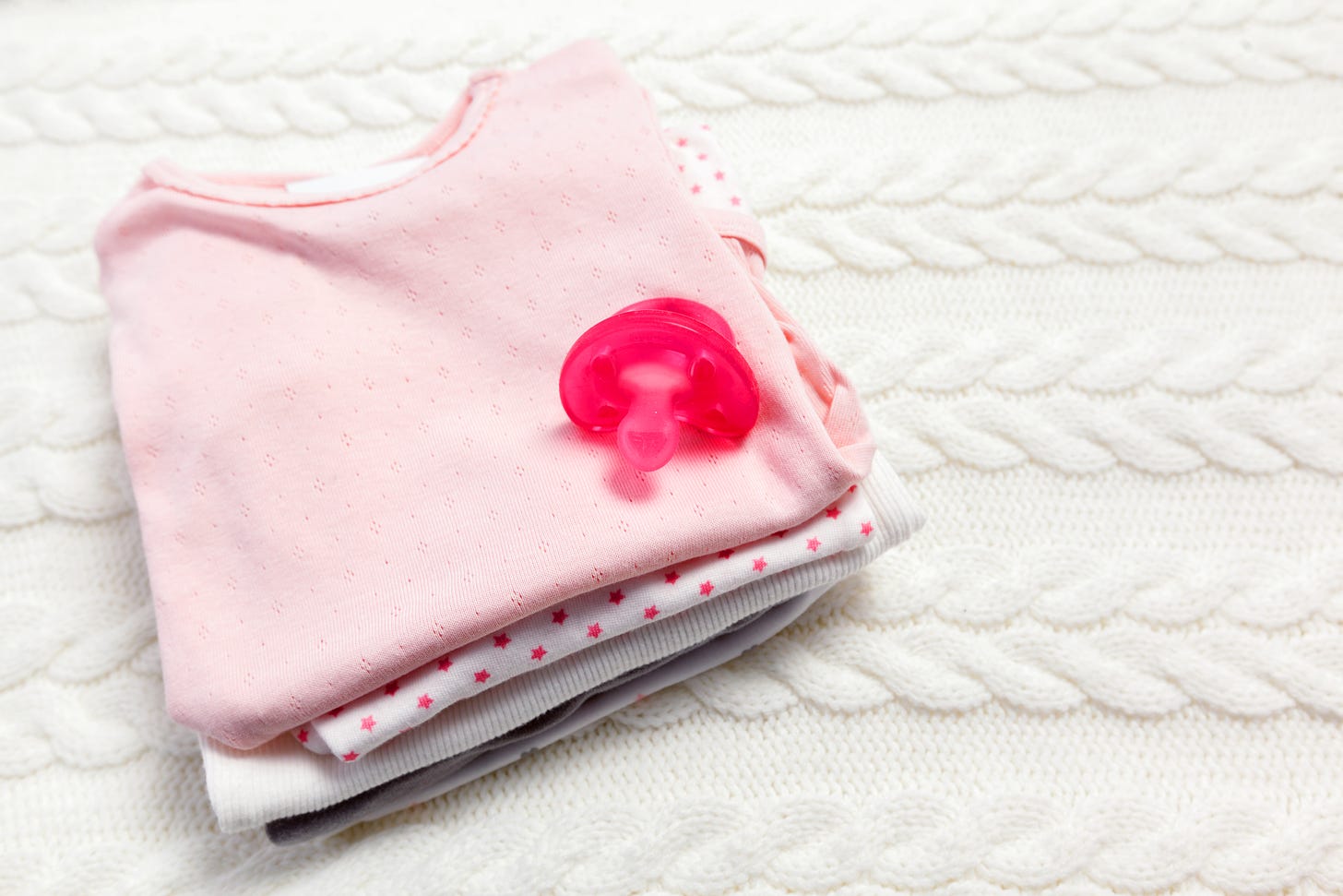 close up of baby clothes on the table