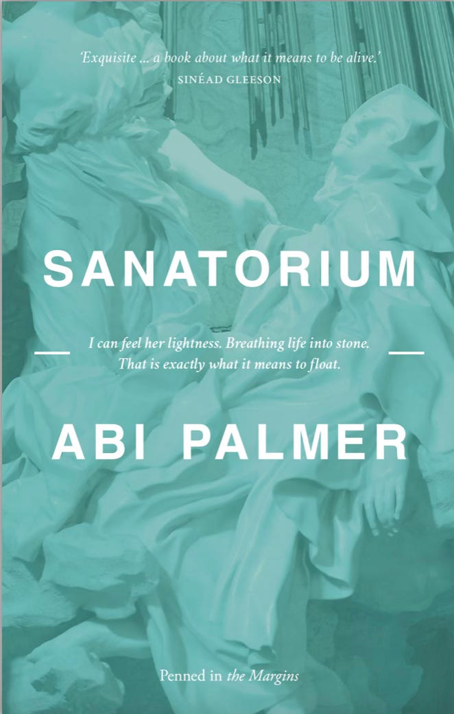 Pale turquoise cover of Sanatorium with echo of an image of a white marble female figure behind solid white text.