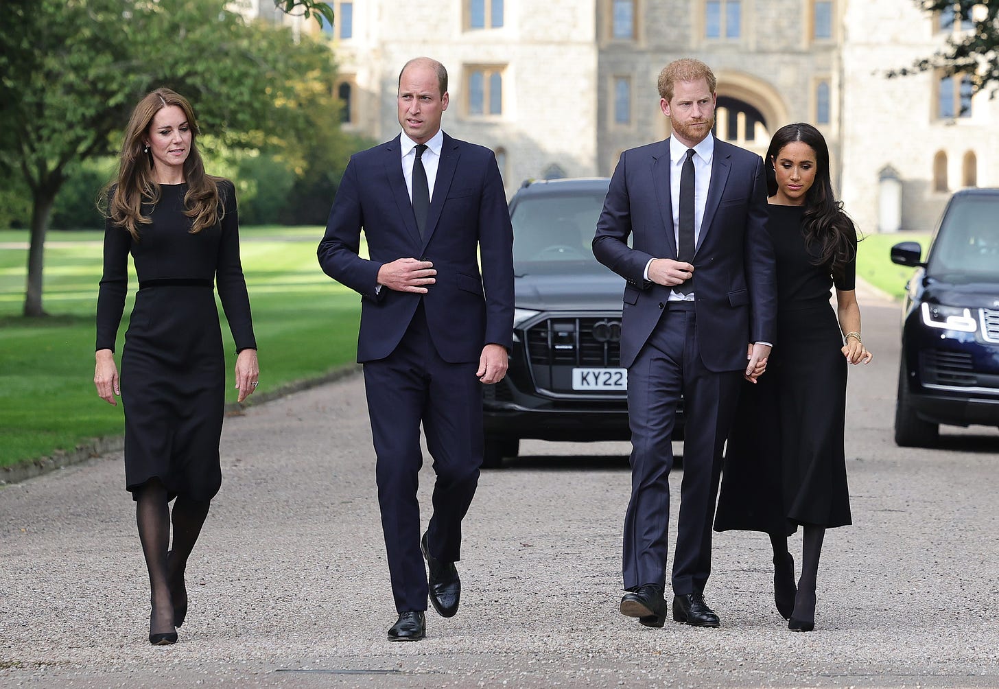 princess kate prince william prince harry and meghan markle view floral tributes for the queen