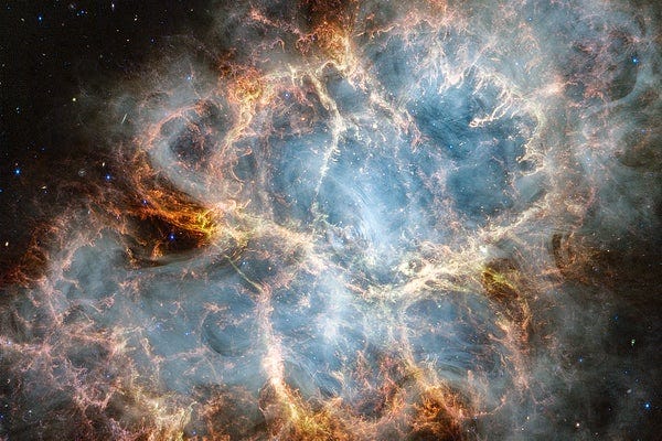 The Crab Nebula in infrared light, taken by the James Webb Space Telescope. Swirls of orange and gray form a bubble-like structure in the blackness of space. The Crab Nebula in infrared light, taken by the James Webb Space Telescope. Swirls of orange and gray form a bubble-like structure in the blackness of space.