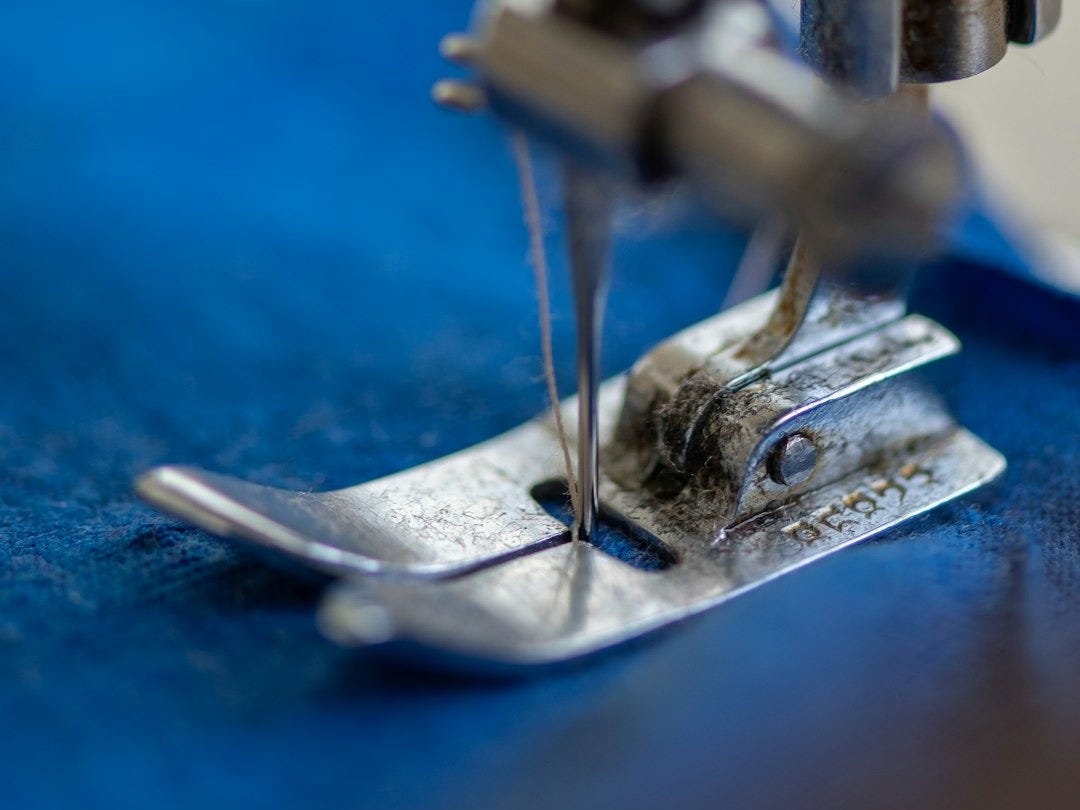 blue and silver sewing machine