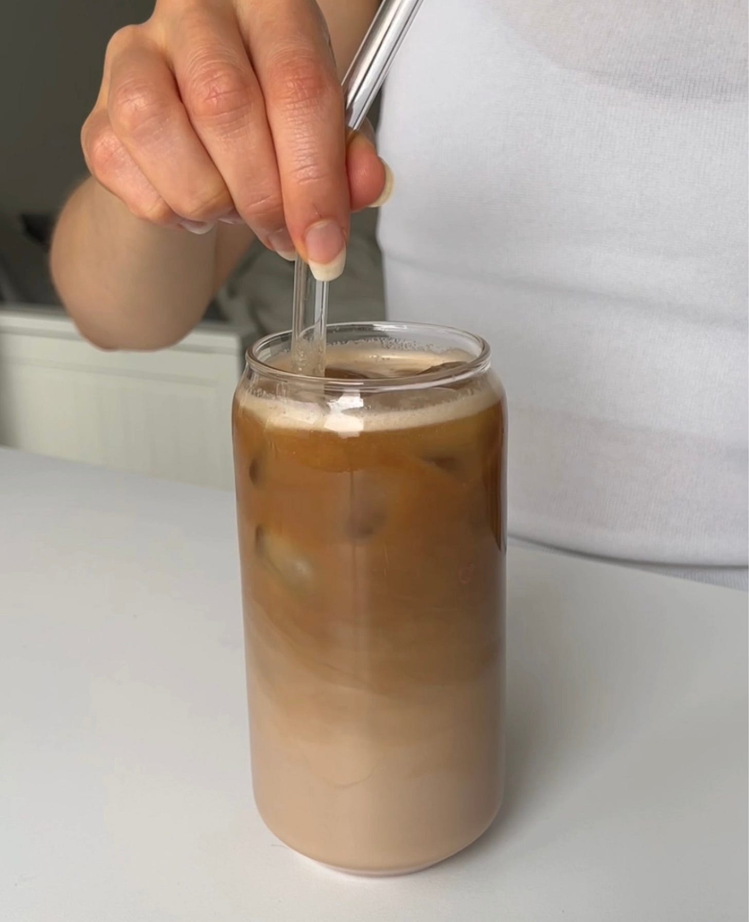 Refreshing iced coffee made with chocolate protein powder, oat milk, and cold brew, served over ice for a smooth and creamy treat.