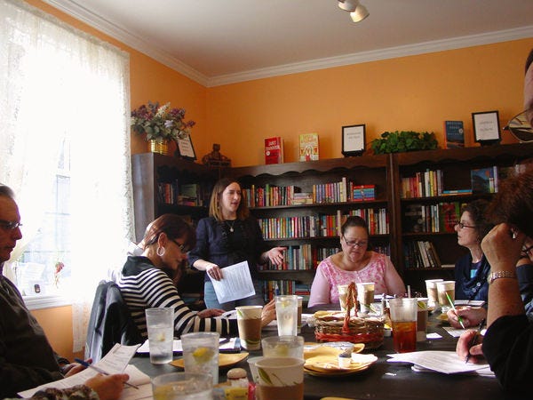 people attending a writing workshop in a bookstore