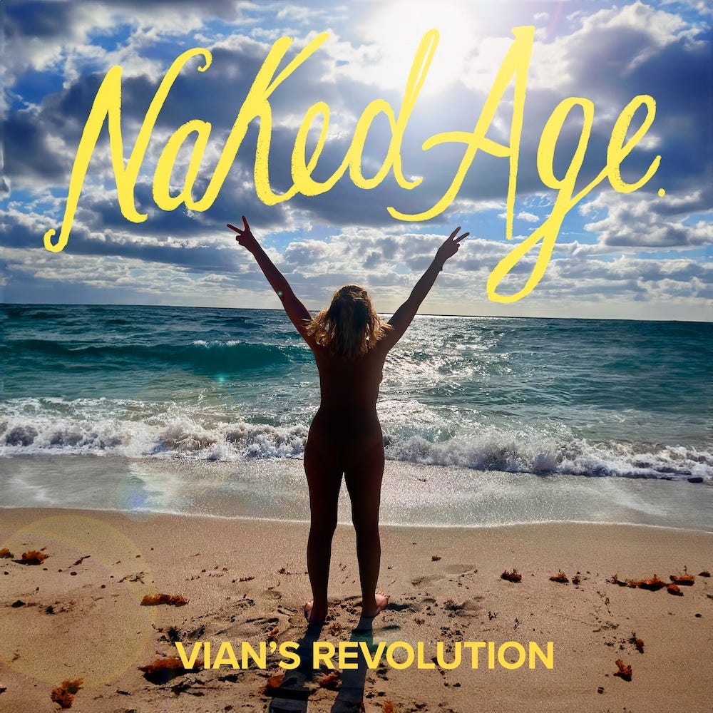 Podcast thumbnail for Naked Age featuring the episode titled Vian’s Revolution. The image shows Vian Aziz, a nude person with shoulder-length blonde hair, standing in silhouette on a sandy beach with their back to the camera. They face the ocean and the sun, which shines through a partly cloudy sky, with arms raised in a 'V' shape, making peace signs with both hands. The waves crash onto the shore, and seaweed is scattered on the sand. The title Naked Age is displayed in large, bright yellow script at the top, while “Vian’s Revolution” appears in smaller yellow capital letters at the bottom.