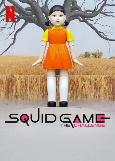 A toy doll standing in a field

Description automatically generated
