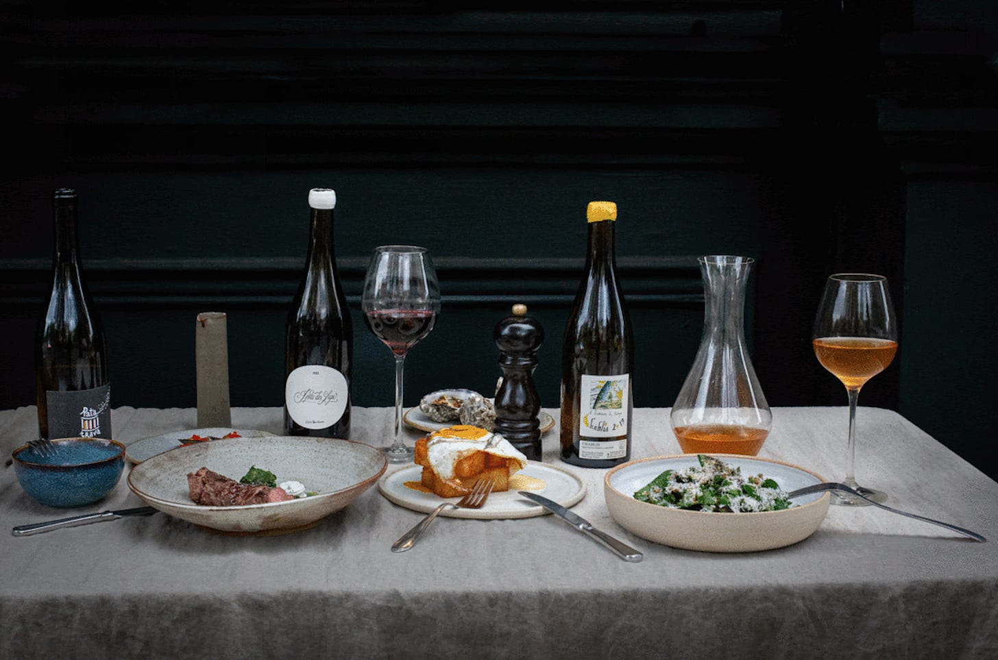 An array of modern food and wine in glasses and bottles