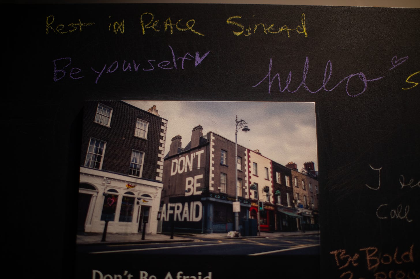 Part of the chalk wall in the final room of the Seamus Heaney "Listen Now Again" exhibit in Dublin. July 2023. A mural has been painted on the side of a Dublin shop that says "Don't be afraid." July 2023. Photo credit: Nancy Forde