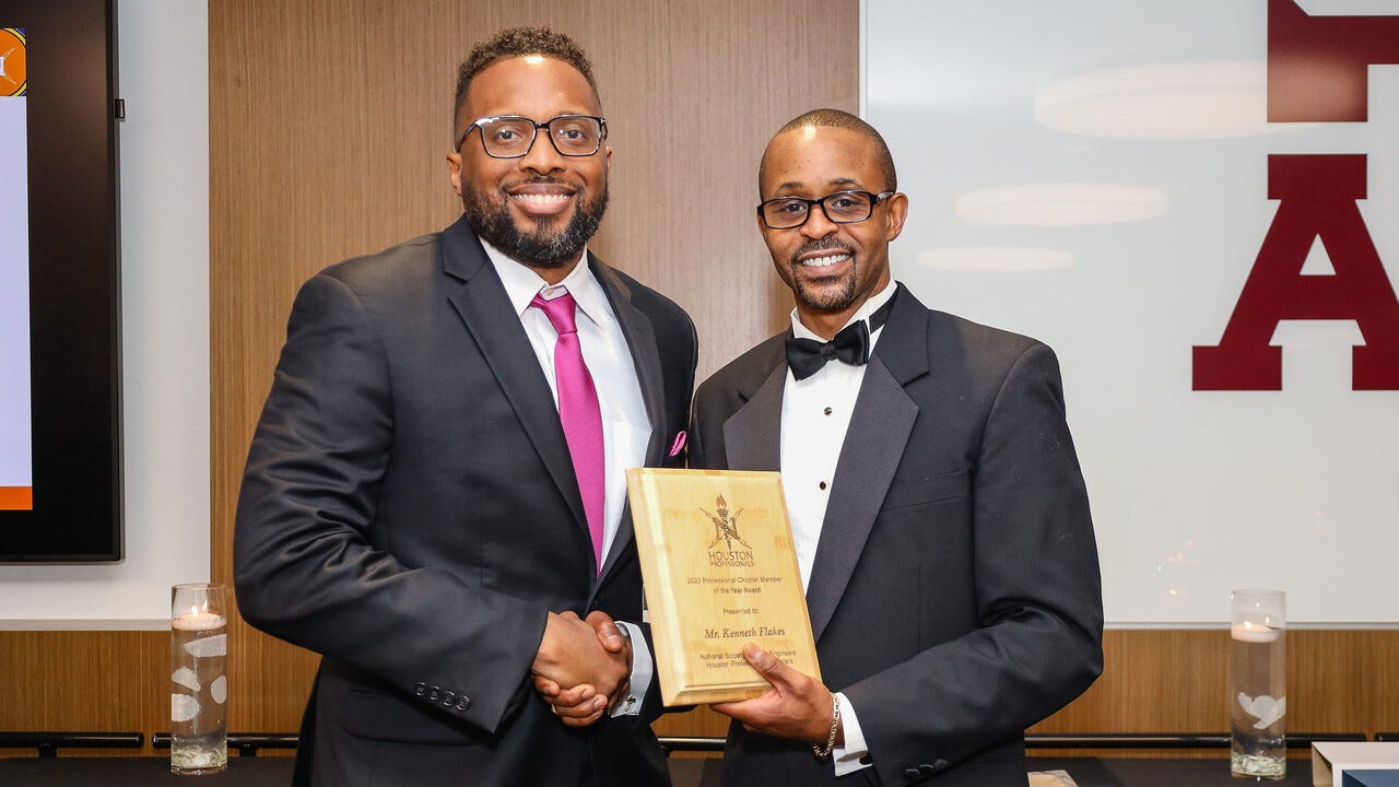 Kenneth Flakes with Dr. Gray, President of the NSBE Houston Professionals, at the Scholarship & Awards Banquet on June 23, 2023.