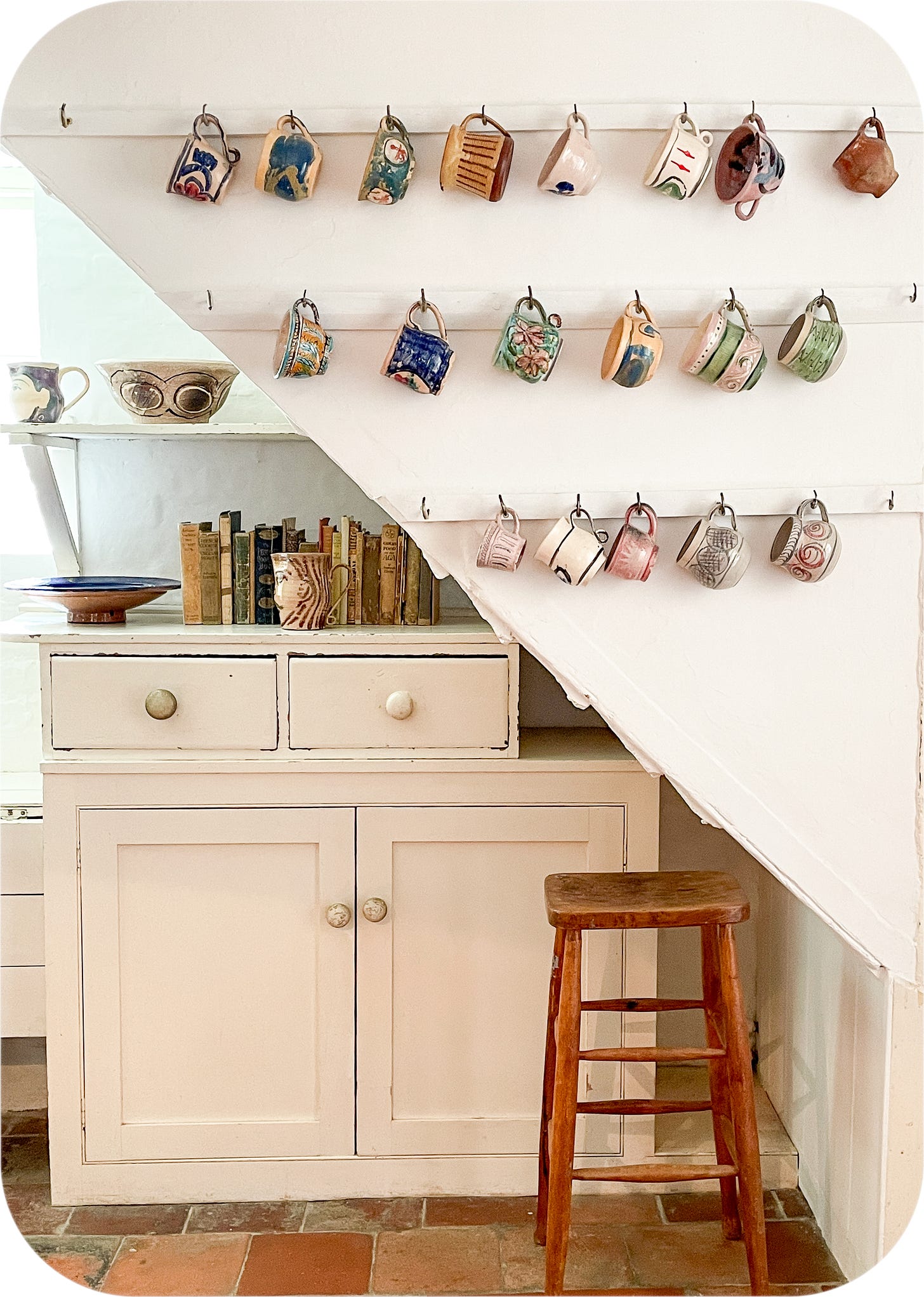 The kitchen at Charleston Farmhouse with cups by Quentin Bell
