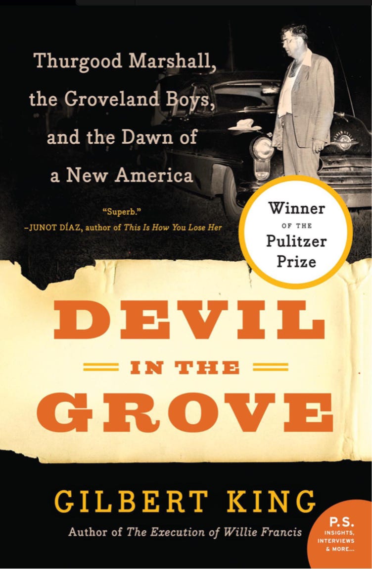 The book cover for “Devil in the Grove” which has a black and white photo of a White man in a suit standing next to a 1950s sedan.