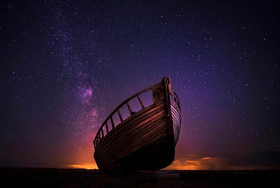 Boat on the sea under a starry sky Boat on the sea under a starry sky