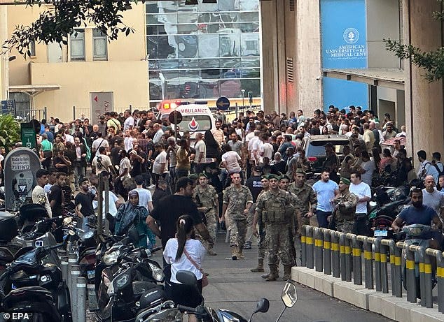 Lebanese soldiers and Hezbollah members gather outside a hospital where injured people were being transported, following an incident involving Hezbollah members' wireless devices in Dahieh, Beirut, south Lebanon, 17 September 2024