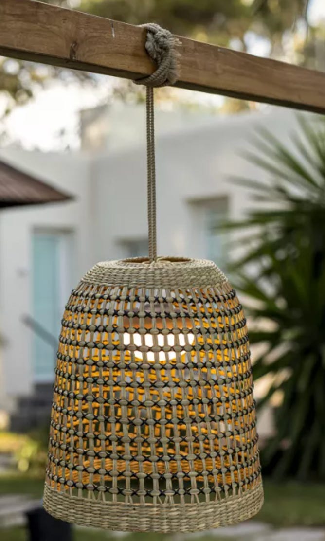 Natural lampshade which hangs off a rope