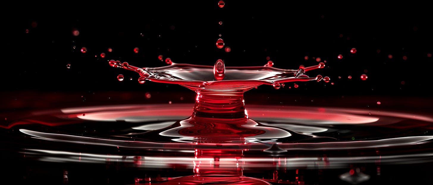 A red liquid droplet splashing into a dark liquid, creating a crown-like shape with smaller droplets around it.