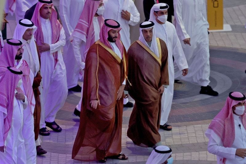Saudi Arabia's Crown Prince Mohammed bin Salman is toured around Expo 2020 Dubai by the UAE's deputy prime minister Sheikh Mansour bin Zayed Al-Nahyan (C-R), in the gulf emirate of Dubai on December 8, 2021.