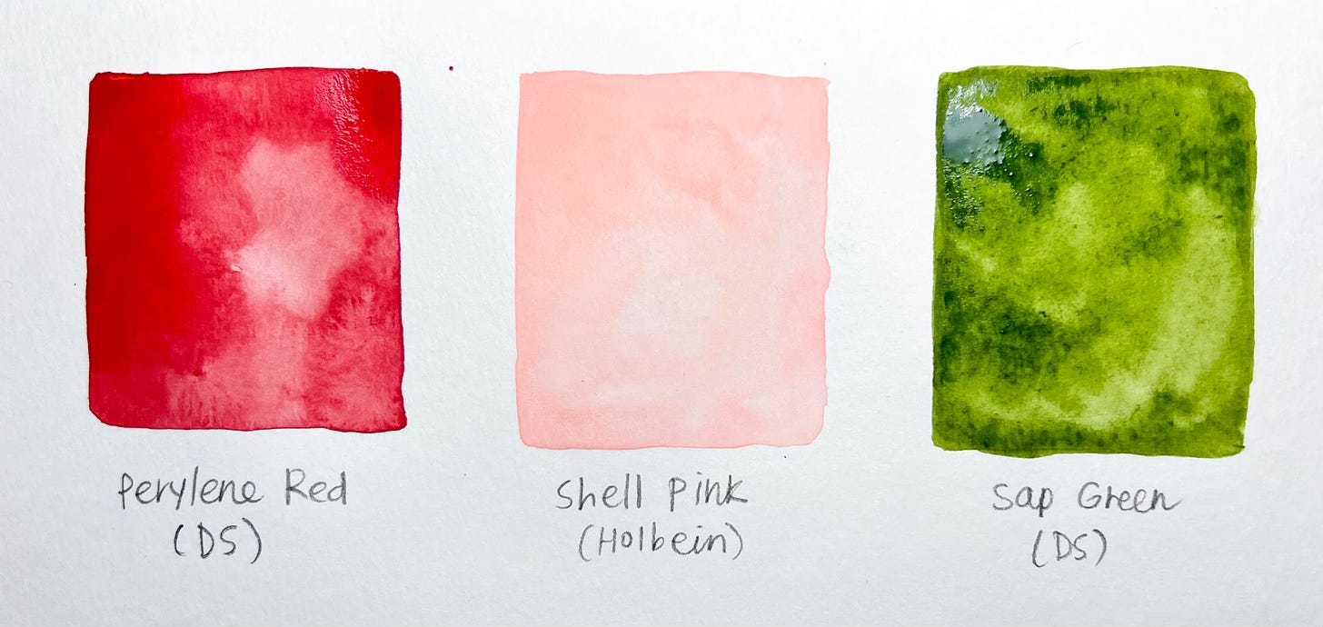 image of three watercolor paint swatches, perylene red by Daniel Smith on the left, Shell Pink by Holbein in the middle, Sap green by Daniel Smith on the right. 