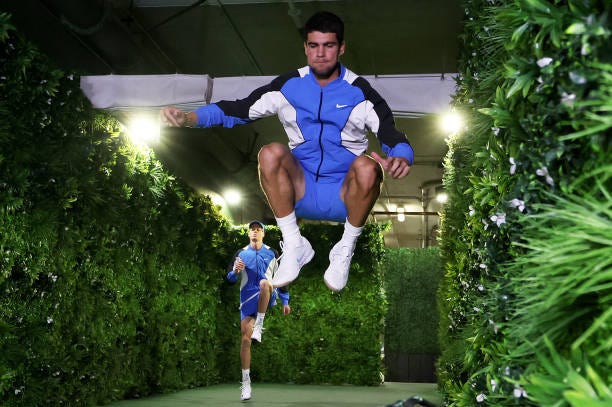 Carlos Alcaraz of Spain and Jannik Sinner of Italy warm up in the players tunnel prior to their Mens Semifinal match during the BNP Paribas Open at...