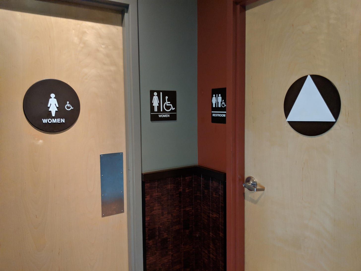 Women get to use both restrooms + the women's restroom is bigger (no lock). Seems equal ...