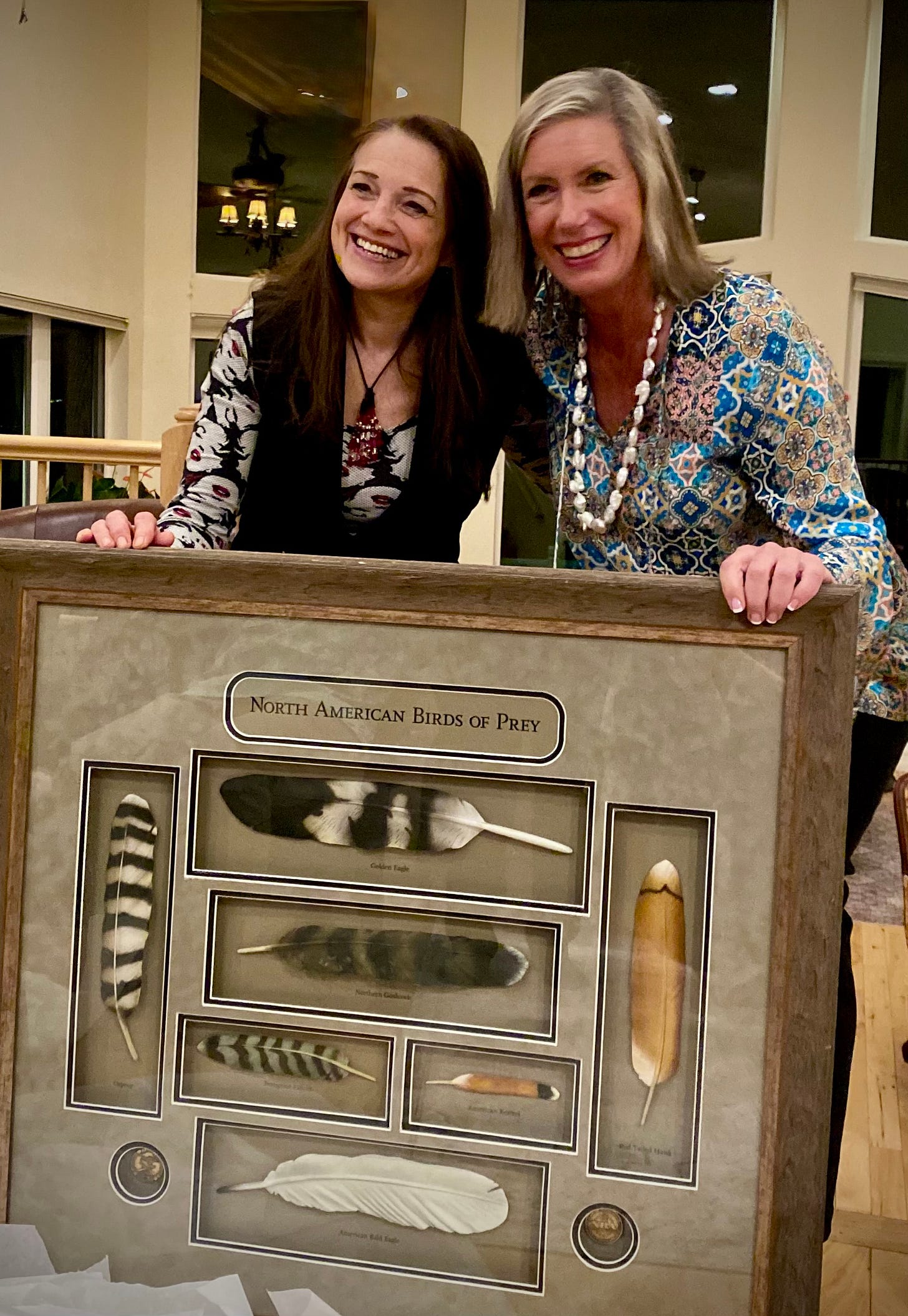 Two women and framed art