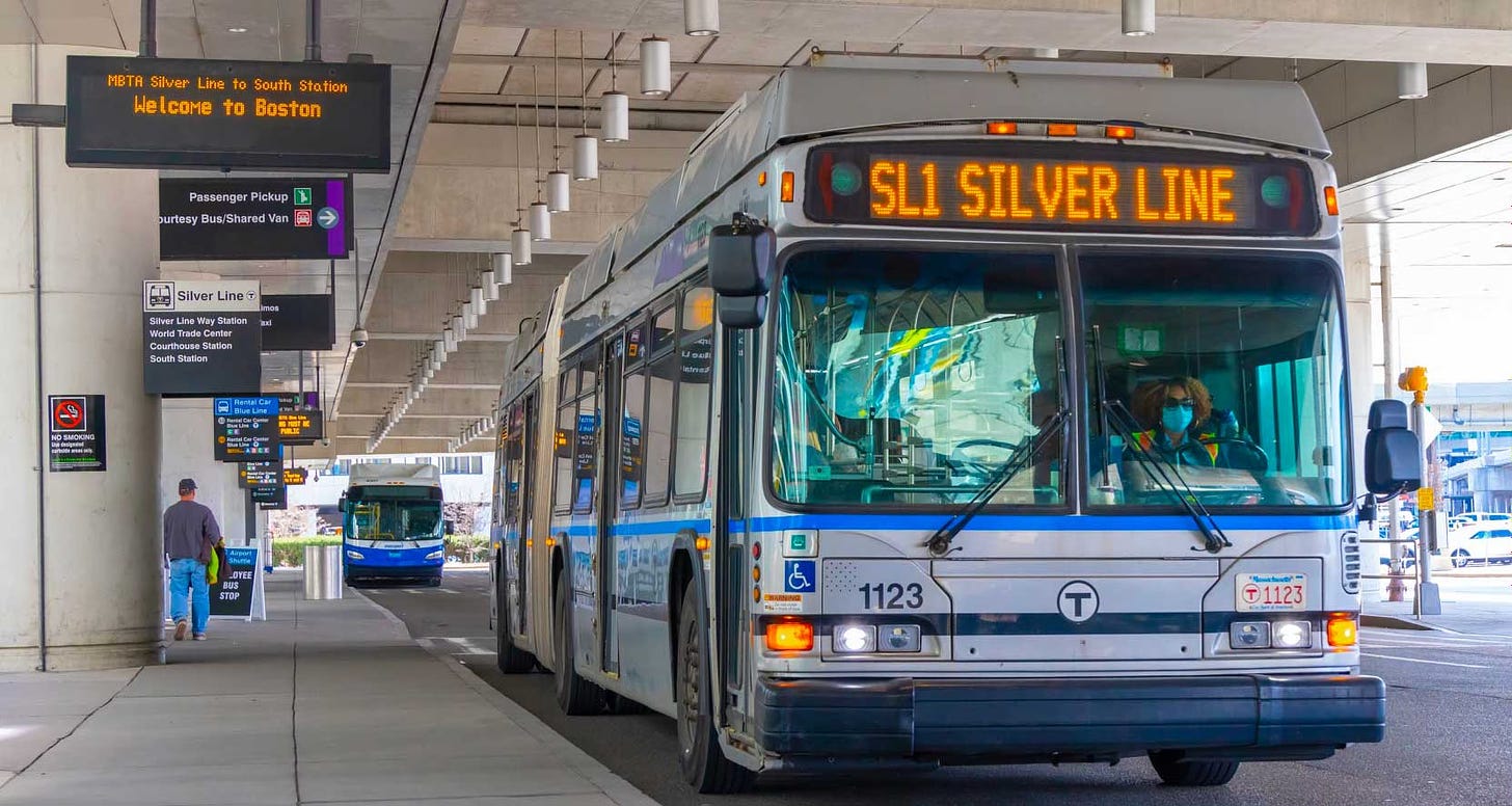 Silver Line bus parked at Boston airport terminal.