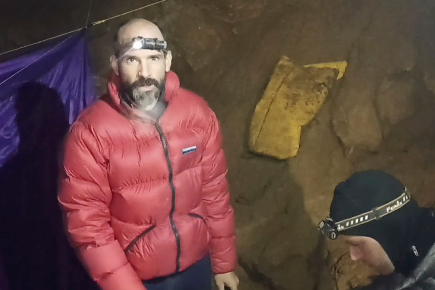 In this screen grab from video, American caver Mark Dickey, 40, talks to camera next to a colleague inside the Morca cave near Anamur, southern Turkey, Thursday, Sept. 7, 2023.