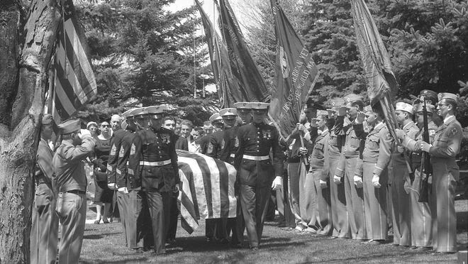 Marine pallbearers carry the casket of U.S. Sen. Joseph R. McCarthy under flags of veterans organizations as they neared the grave in St. Mary’s Catholic Cemetery in Appleton. Members of McCarthy’s immediate family followed. This photo was published in the May 8, 1957, Milwaukee Journal. Marine pallbearers carry the casket of U.S. Sen. Joseph R. McCarthy under flags of veterans organizations as they neared the grave in St. Mary’s Catholic Cemetery in Appleton. Members of McCarthy’s immediate family followed. This photo was published in the May 8, 1957, Milwaukee Journal.