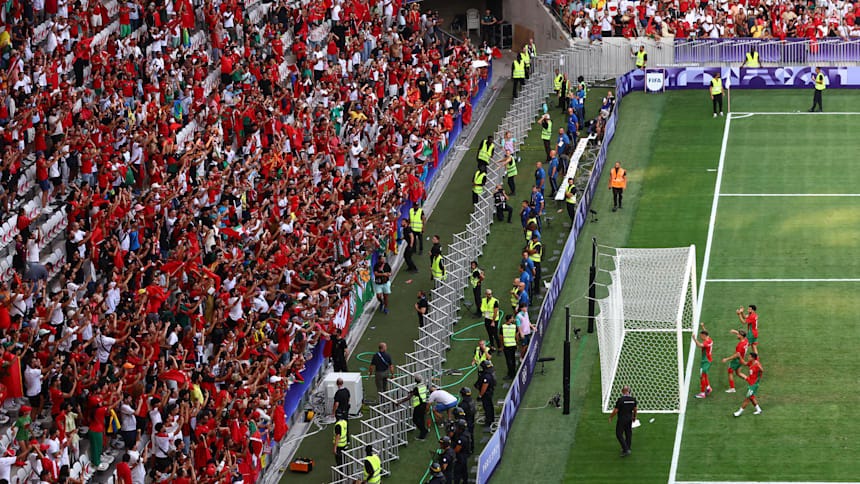 Morocco celebrates with their fans at Paris 2024. 