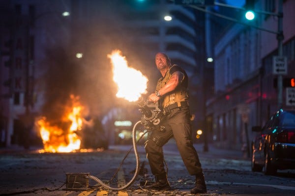 dwayne johnson pulling bulge on furious 7 mini gun 2015 images