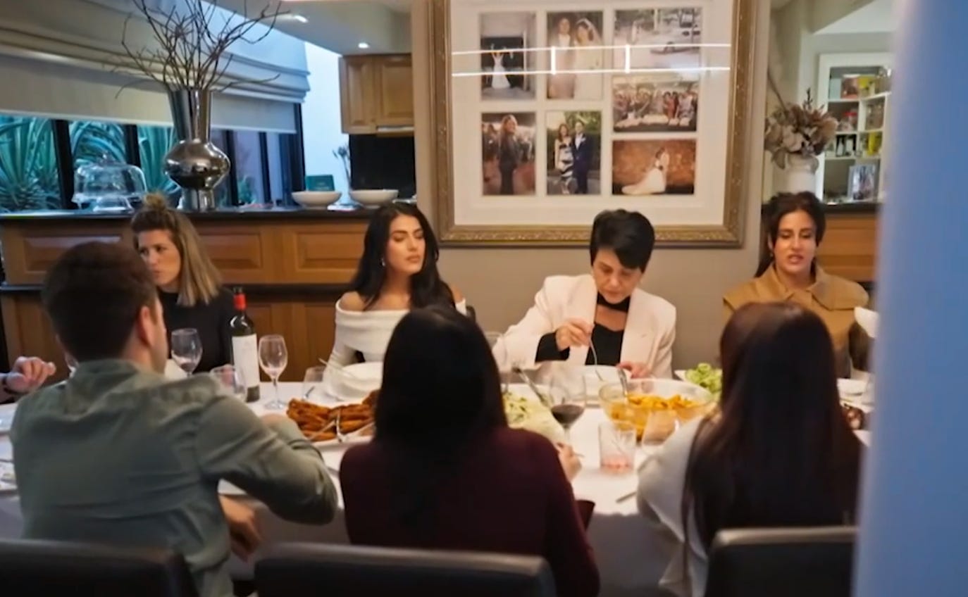 Carina sitting with family during a MAFS episode. 