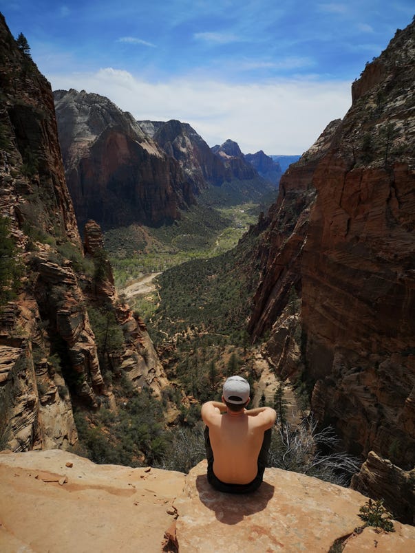 Man looking out over a valley