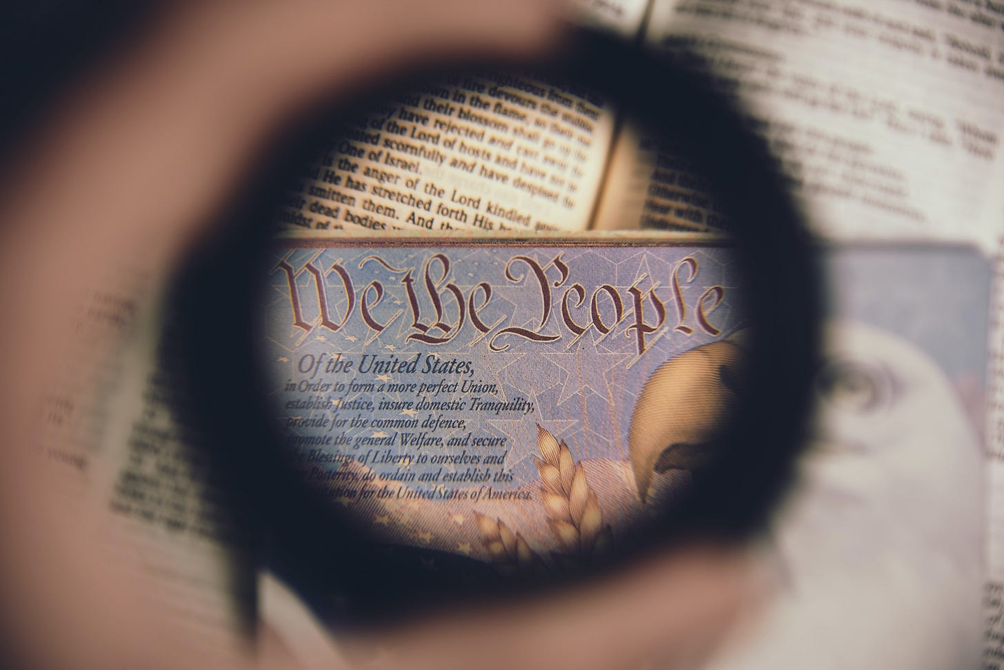 A loupe examines the US constitution. (Anthony Garand / Unsplash) A loupe examines the US constitution. (Anthony Garand / Unsplash)