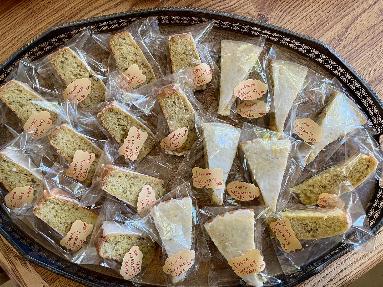 a tray of slices individually wrapped of the rosemary-lemon olive oil cake