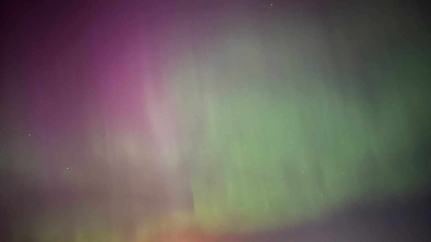 Northern Lights, image of the sky which is pink and green