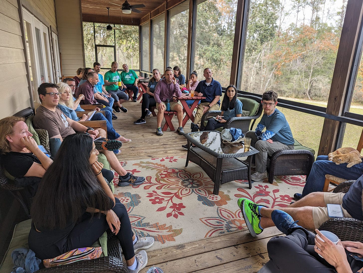 May be an image of 12 people, people smiling, people studying and table