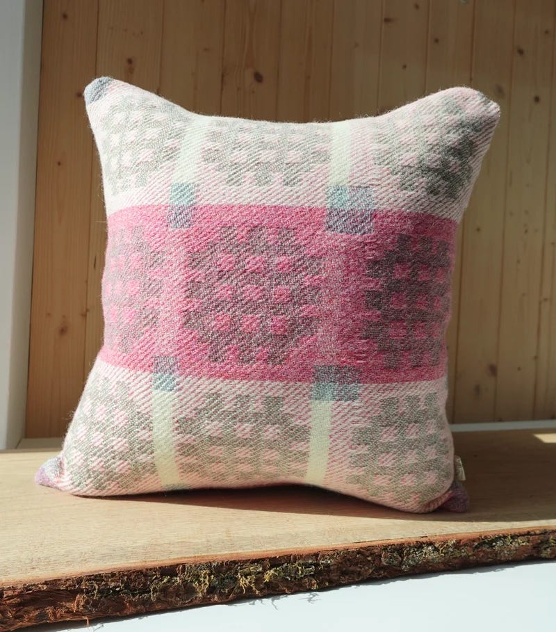 A pink and grey pillow

Description automatically generated